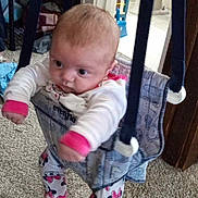 Anaiah is registered to the contest to win money with this photo: baby, clothing, costume, face, furniture, head, jeans, outdoorplayarea, outdoors, pants, person, photography, playarea, portrait, quilt, shorts, sitting, standing, swing, toy