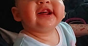 Rayla is registered to the contest to win money with this photo: baby, casual, child, childhood, comfort, cute, drool, face, happy, head, home, indoor, infant, light, person, portrait, seated, smiling, tshirt, young
