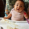 Rayla joined the competition — help win amazing prizes! baby, camouflage, child, clothing, curious, cushion, expression, face, feeding, food, high_chair, indoor, mess, messy, person, pink, portrait, seat, spoon, table