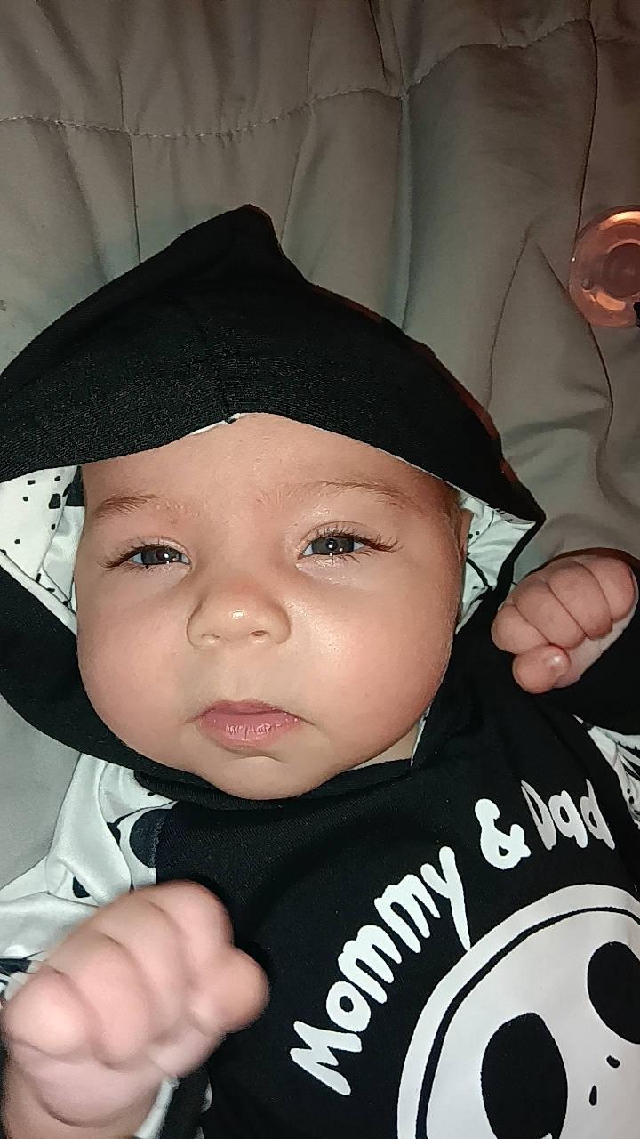 Aria is registered to the contest to win money with this photo: baby, baby_products, baseball_cap, cap, cheek, child, eyebrow, eyelash, fashion_accessory, finger, flash_photography, fun, gesture, happy, hat, headwear, person, personal_protective_equipment, skin, tableware