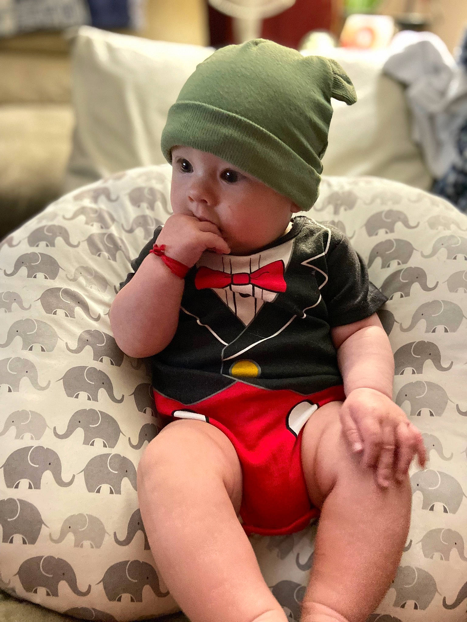 Jesse joined the competition — help win amazing prizes! baby, baby_toddler_clothing, cap, child, comfort, head, headwear, human_body, human_leg, knee, lap, leg, pattern, person, personal_protective_equipment, shorts, sitting, skin, sleeve, sock
