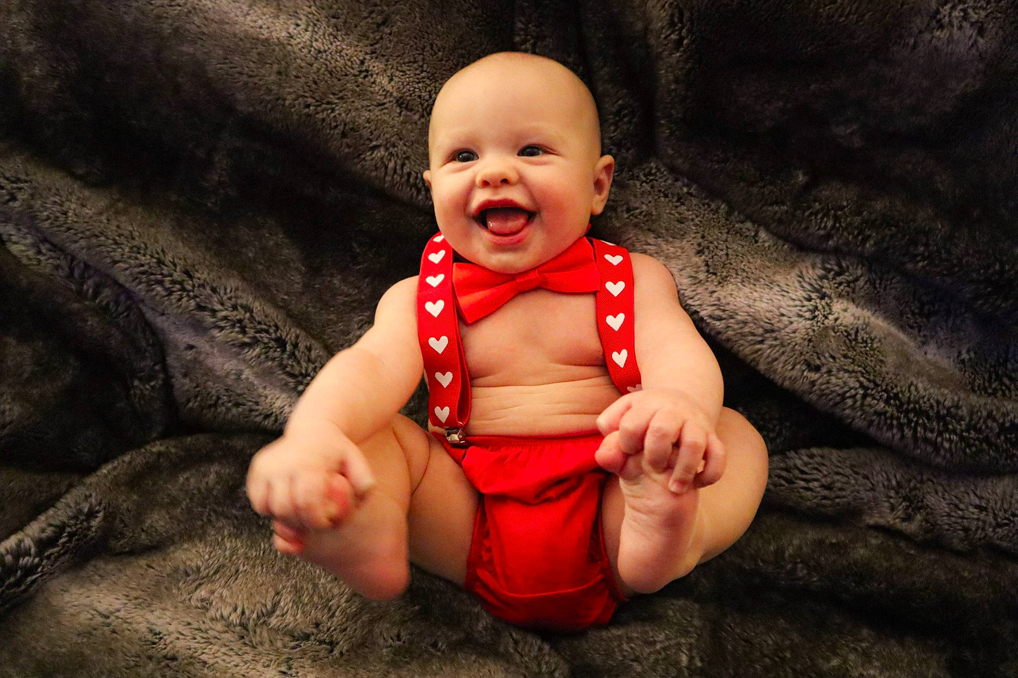 Jesse is registered to the contest to win money with this photo: baby, baby_toddler_clothing, chin, comfort, dress, eye, face, flash_photography, foot, gesture, grass, happy, headwear, human_body, human_leg, joy, lip, mouth, person, smile
