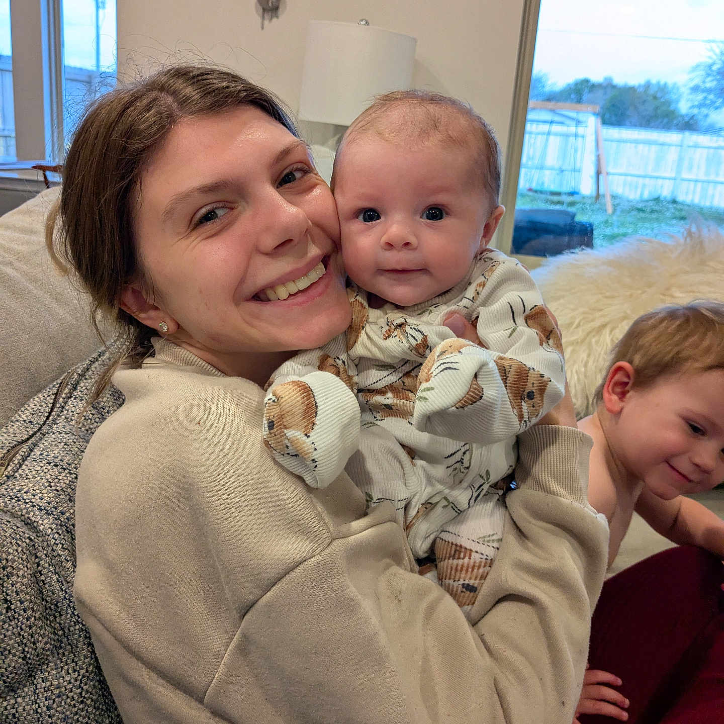 Taytum joined the competition — help win amazing prizes! adult, baby, blanket, clothing, couch, face, female, furniture, happy, head, homedecor, knitwear, newborn, people, person, photography, portrait, smile, sweater, woman