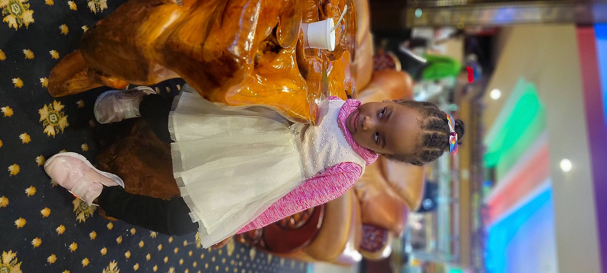 Joanna is registered to the contest to win money with this photo: amusement_ride, art, child, event, festival, fun, happy, leisure, metal, pattern, person, sculpture, statue, sunglasses, toddler, tradition, tree, vacation, water