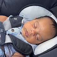 Miguel joined the competition — help win amazing prizes! baby, sleeping, car_seat, child, infant, stripes, safety_harness, closeup, face, peaceful, resting, young_child, seatbelt, cushion, comfort, indoors, cute, portrait, small_child, head_support