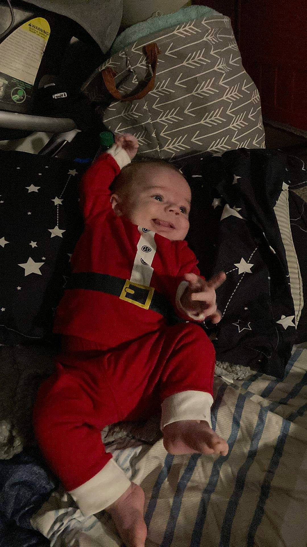 Grayson joined the competition — help win amazing prizes! baby, carmine, child, christmas, christmas_eve, comfort, costume, event, flooring, fun, holiday, lamp, lap, pattern, person, room, sitting, smile, sock, toddler
