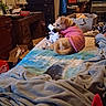 Honey is registered to the contest to win money with this photo: air_conditioner, bed, blanket, box, carpet, clutter, desk, dog, fabric, furniture, indoor, lamp, panda, pet, pink_shirt, room, stuffed_toy, television, window, wooden_drawers