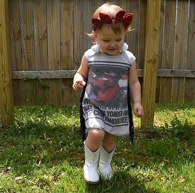 Oaklyn joined the competition — help win amazing prizes! baby_toddler_clothing, child, door, eyewear, face, fence, glasses, grass, human_leg, joy, knee, pattern, people_in_nature, person, personal_protective_equipment, shorts, sleeve, t_shirt, thigh, toddler