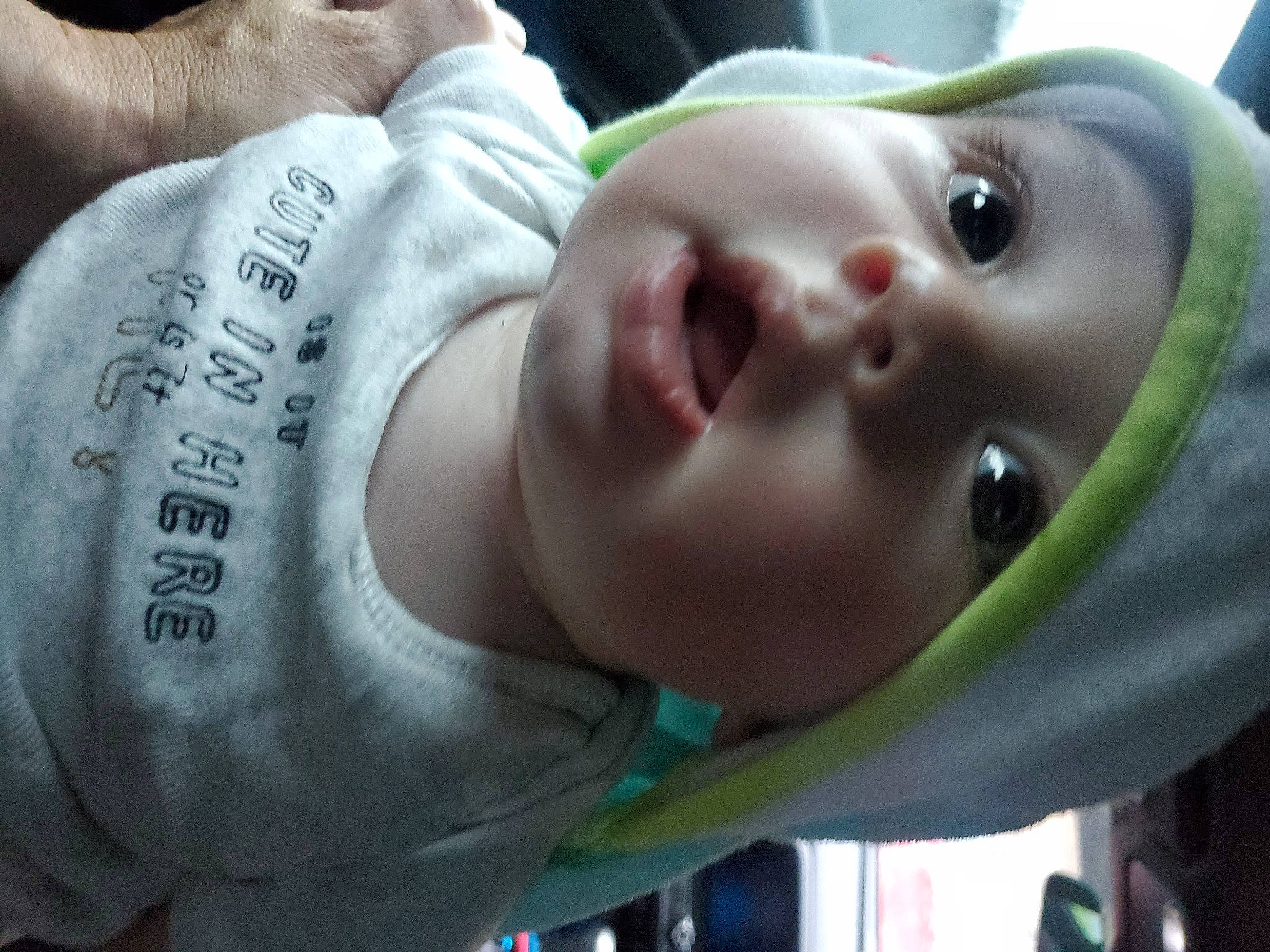 Atlas is registered to the contest to win money with this photo: baby, baby_products, baby_toddler_clothing, cheek, chest, child, eyelash, grass, green, happy, human_body, lip, mouth, nose, skin, sleeve, smile, toddler, tree, white