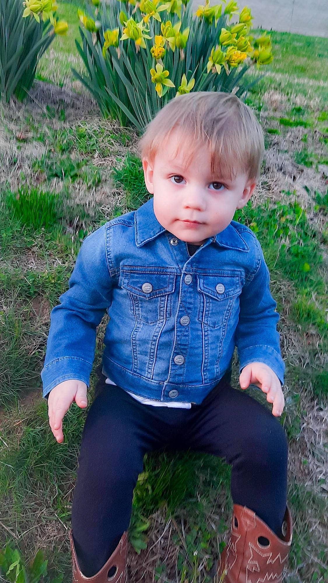 Eastan is registered to the contest to win money with this photo: baby_toddler_clothing, blond, denim, doll, dress_shirt, electric_blue, eye, flower, grass, grass_family, iris, leaf, outerwear, pattern, people_in_nature, person, plant, sleeve, toddler, tree