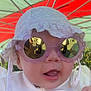 Capucine a rejoint le concours — aidez-le/la à gagner de superbes lots ! baby, sunglasses, hat, white_clothing, face, mouth_open, outdoor, reflection, tent, colorful, child, person, headwear, cute, fashion, summer, accessory, closeup, portrait, playful