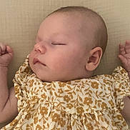 Capucine a rejoint le concours — aidez-le/la à gagner de superbes lots ! baby, sleeping, infant, floral_dress, soft_skin, peaceful, closeup, arm, hand, face, child, young, cute, portrait, resting, indoors, calm, newborn, gentle, serene