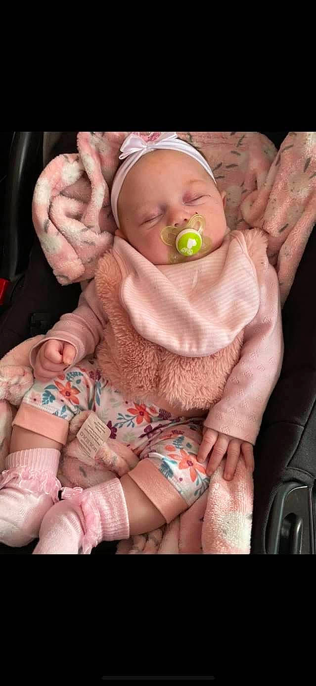 Isla-mae is registered to the contest to win money with this photo: arm, baby, baby_sleeping, baby_toddler_clothing, cheek, child, comfort, eye, face, finger, gesture, hand, head, mouth, nail, person, pink, skin, textile, thumb