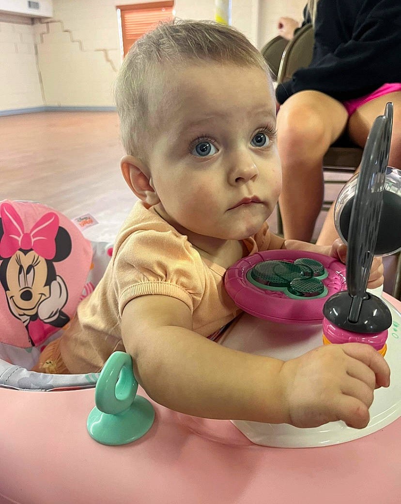 Raylee is registered to the contest to win money with this photo: baby, baby_playing_with_toys, baby_products, baby_toddler_clothing, cheek, child, finger, flooring, fun, hand, happy, mammal, mouth, nose, person, play, sitting, skin, surprise, thumb