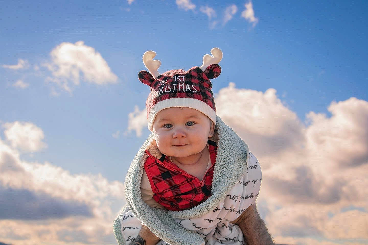 Joey is registered to the contest to win money with this photo: baby, beanie, cap, clothing, cloud, fashion_accessory, flash_photography, freezing, fun, grass, happy, headwear, knit_cap, landscape, pattern, people_in_nature, person, plaid, sky, smile