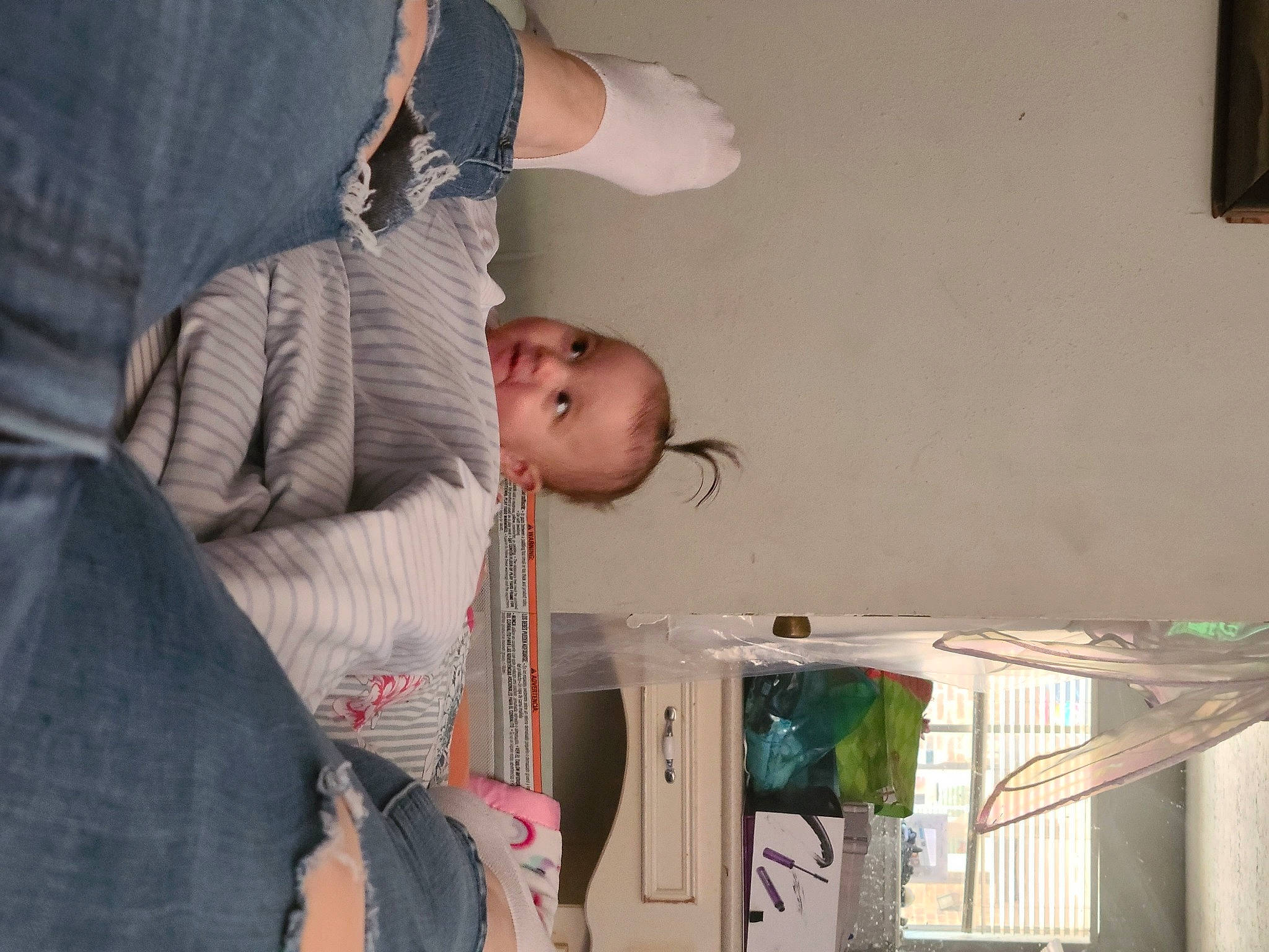 Emilee is registered to the contest to win money with this photo: baby, baby_products, child, comfort, elbow, event, fun, gesture, happy, person, picture_frame, room, sitting, toddler, tree, wood