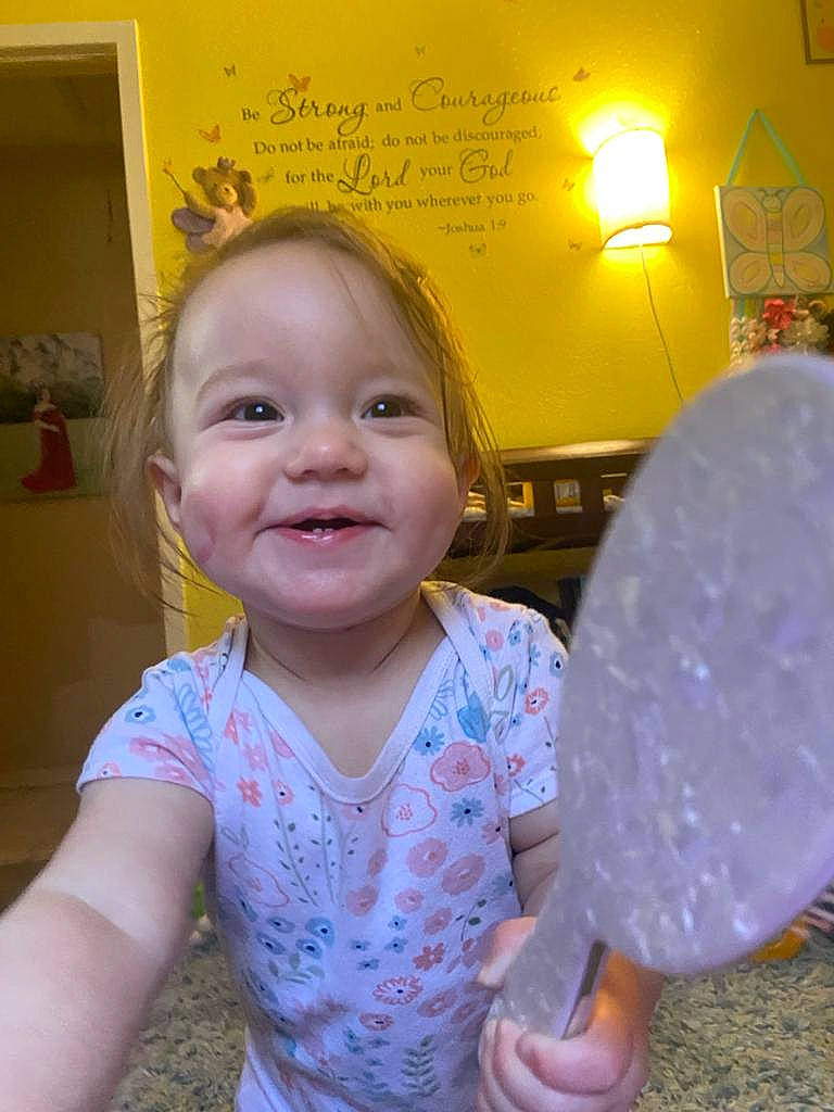 Emilee is registered to the contest to win money with this photo: baby, baby_toddler_clothing, balloon, child, event, eye, facial_expression, fun, handwriting, happy, joy, leisure, party_supply, person, pink, smile, snapshot, standing, t_shirt, toddler