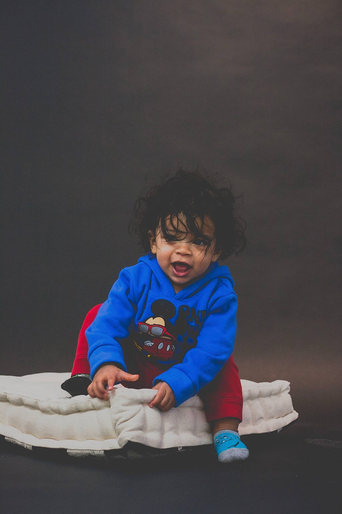 Mylo joined the competition — help win amazing prizes! baby, baby_toddler_clothing, child, comfort, darkness, electric_blue, flash_photography, flooring, fun, happy, hood, hoodie, jacket, night, person, portrait_photography, recreation, sitting, sleeve, t_shirt