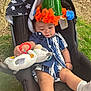 baby, child, car_seat, outdoor, grass, tree_bark, plush_toy, hat, cone_hat, blue_and_white_clothing, infant, toy, relaxed, sitting, cute, young_child, footwear, sock, nature, daylight