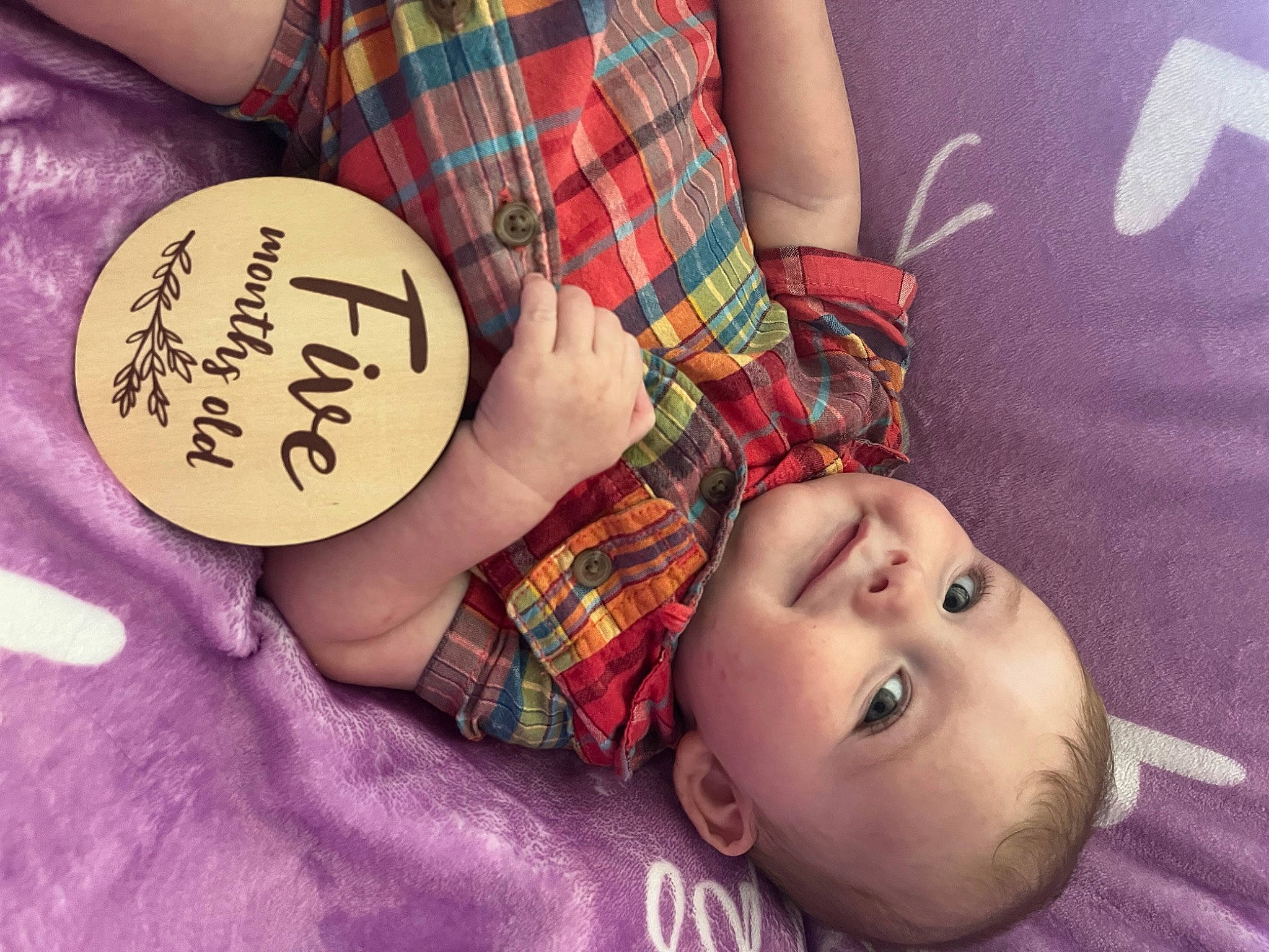Atlas is registered to the contest to win money with this photo: cheek, child, eyelash, fashion_accessory, flash_photography, flesh, happy, head, magenta, pattern, person, pink, plaid, plant, portrait_photography, skin, sweetness, tartan, textile, toddler