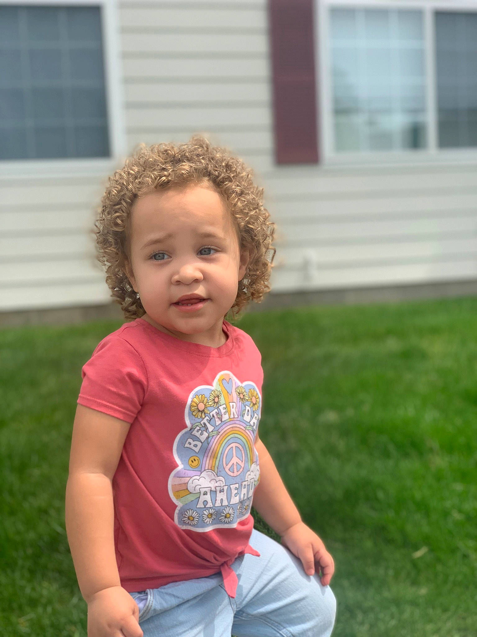 Ariella joined the competition — help win amazing prizes! baby_toddler_clothing, child, fun, garden, grass, grassland, hair, happy, house, lawn, leisure, people_in_nature, person, plant, play, recreation, sitting, t_shirt, toddler, window