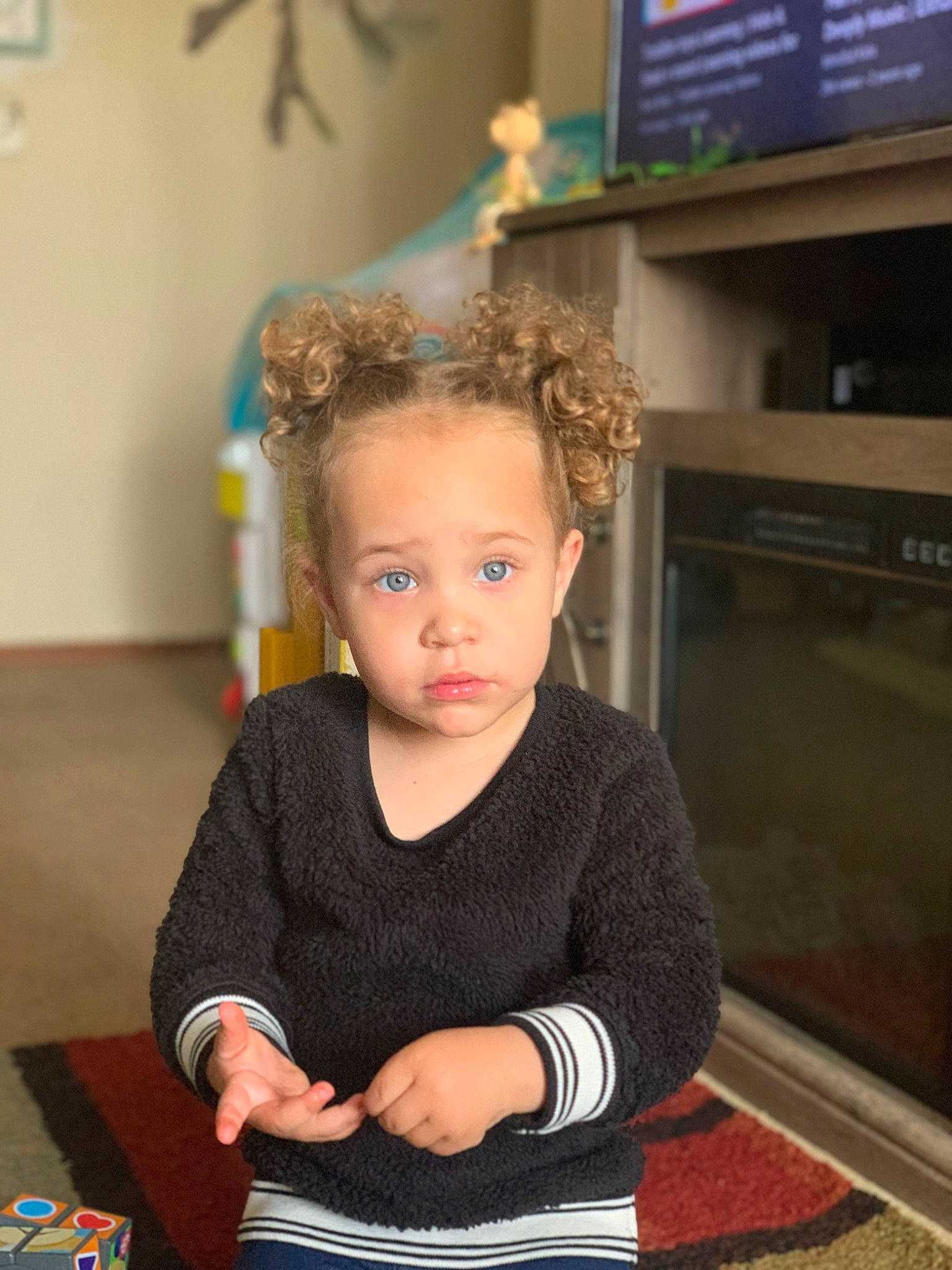 Ariella is registered to the contest to win money with this photo: chair, child, display_device, fashion_accessory, flooring, fun, gadget, happy, home_appliance, jewellery, person, picture_frame, room, sitting, t_shirt, television, television_set, toddler, wood