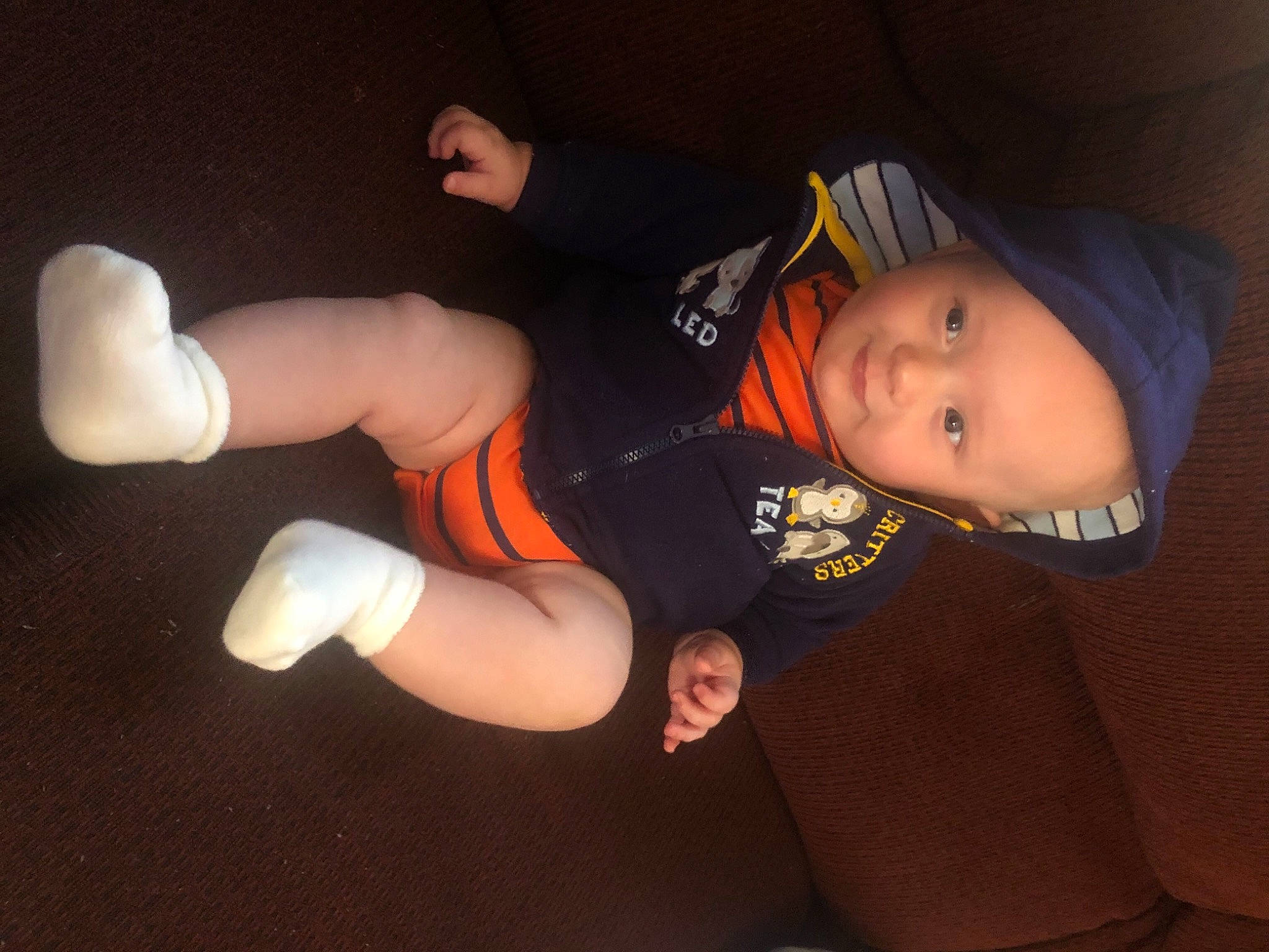 Robbie is registered to the contest to win money with this photo: arm, black_hair, child, ear, finger, fun, headwear, joint, leg, mouth, person, thigh