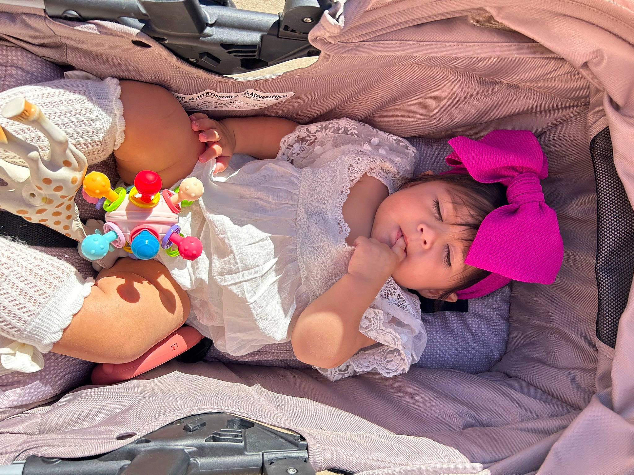 Everlee is registered to the contest to win money with this photo: arm, baby, baby_products, baby_toddler_clothing, bag, child, comfort, finger, fun, hat, headgear, headwear, lap, mouth, pattern, person, pink, summer, textile, thigh