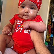 Kaydence joined the competition — help win amazing prizes! arm, baby, child, chubby, closeup, cute, diaper, expression, hand, headwrap, holding, human, indoors, infant, person, polka_dot, portrait, red_clothing, skin, tattoo
