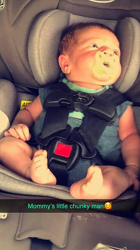 Dayton is registered to the contest to win money with this photo: arm, auto_part, baby, baby_toddler_clothing, car_seat, car_seat_cover, cheek, child, comfort, finger, fun, hand, head_restraint, human, mouth, person, product, seat_belt, snapshot, thumb