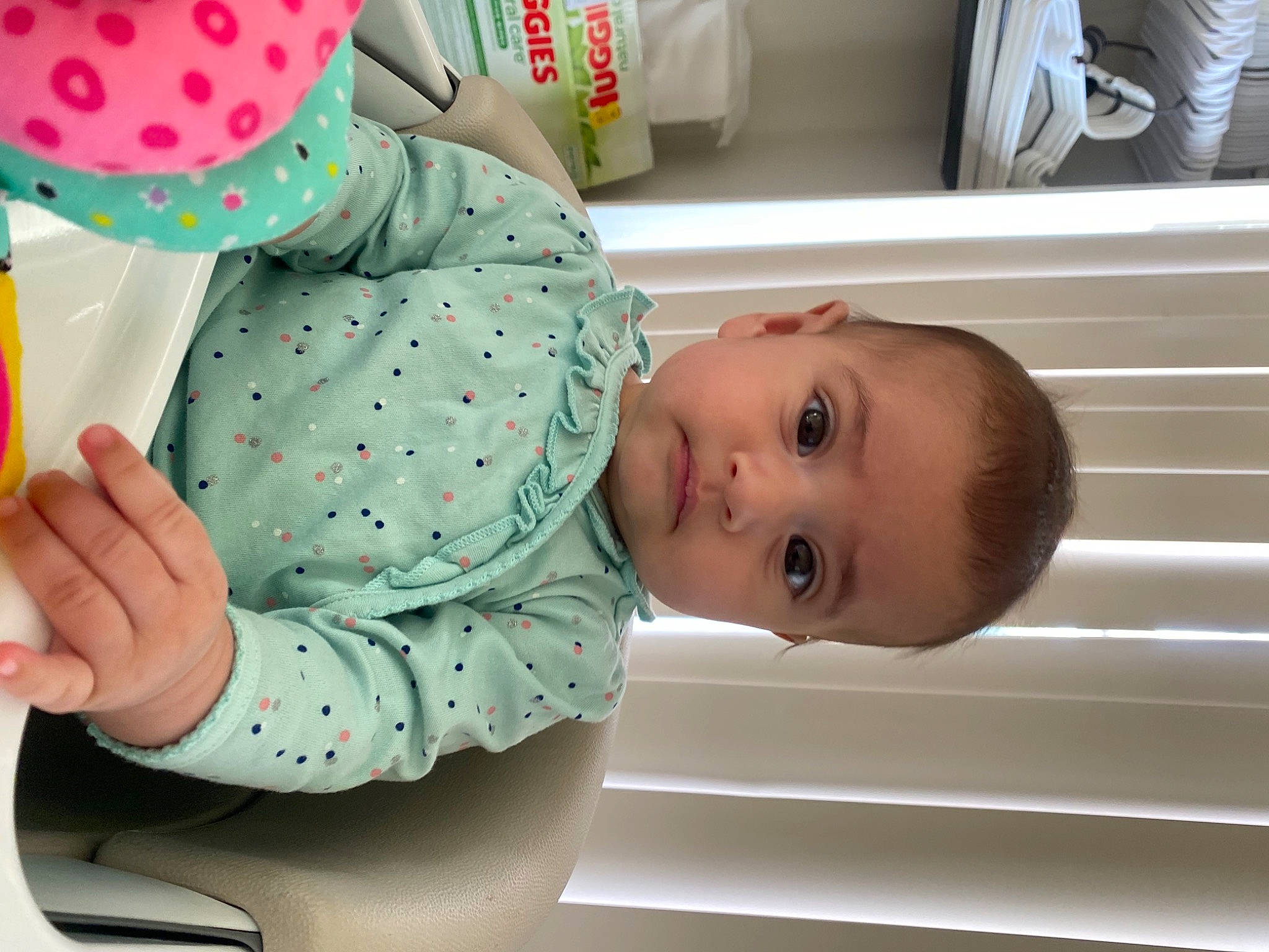 Reyna joined the competition — help win amazing prizes! baby, baby_products, baby_safety, baby_toddler_clothing, child, comfort, green, happy, linens, pattern, person, polka_dot, room, sleeve, smile, toddler, wood
