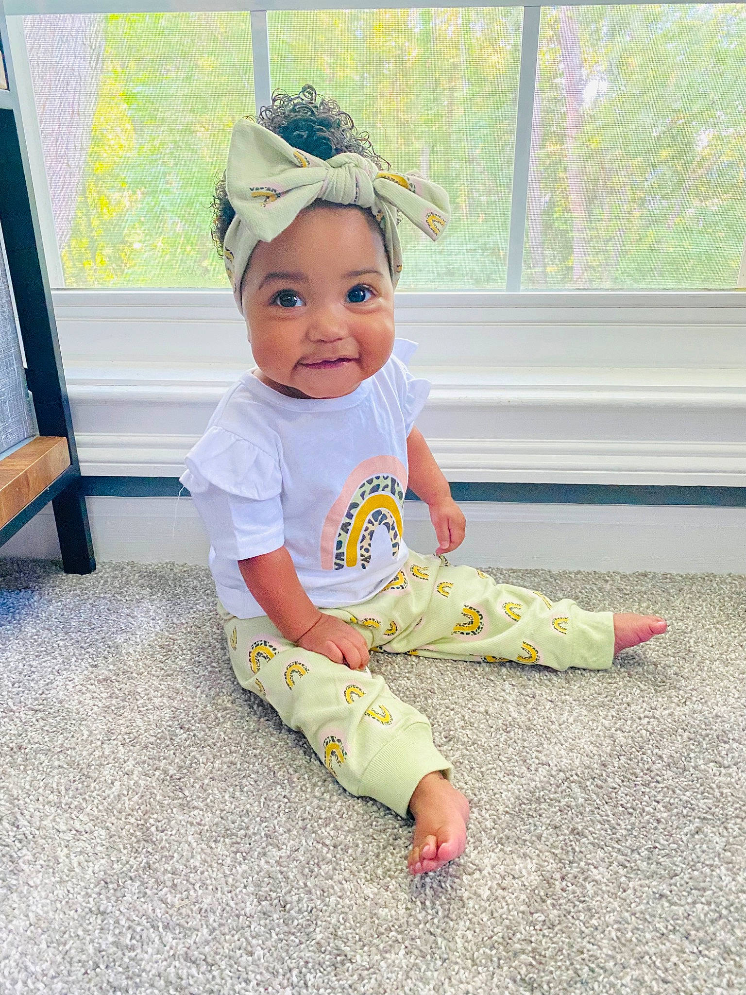 Saige joined the competition — help win amazing prizes! baby, baby_toddler_clothing, cap, child, costume_hat, fashion_accessory, flooring, fun, happy, hat, headband, headpiece, headwear, pattern, person, play, sitting, sleeve, smile, t_shirt