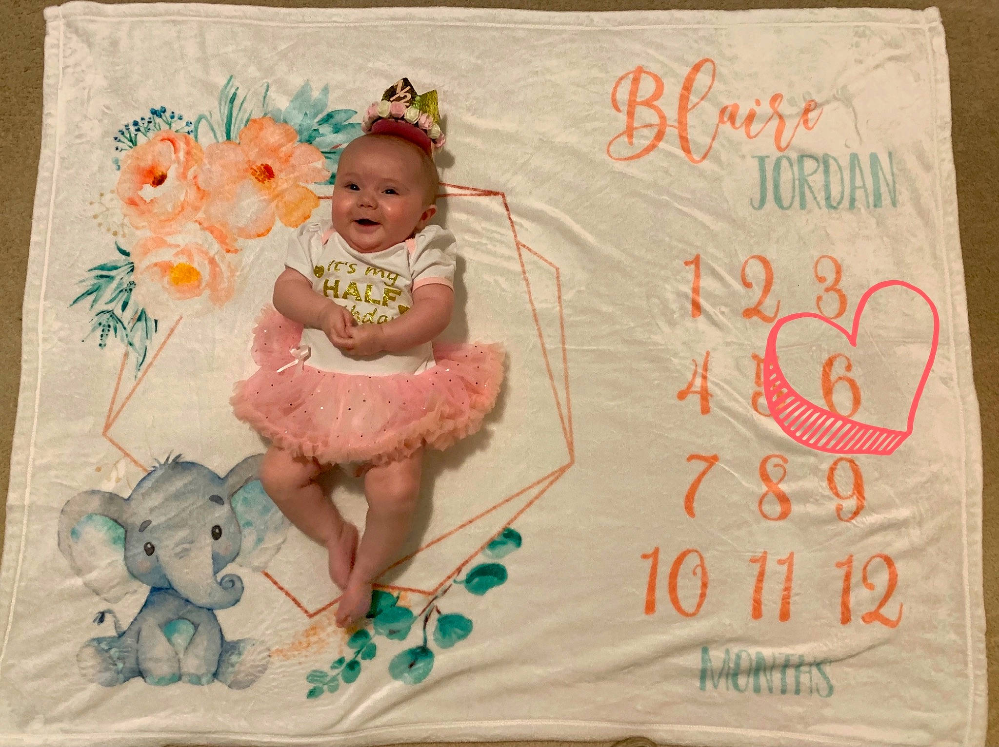 Blaire is registered to the contest to win money with this photo: art, baby, baby_toddler_clothing, cheek, child, design, face, font, handwriting, happy, illustration, linens, pattern, person, pink, product, rectangle, room, smile, textile