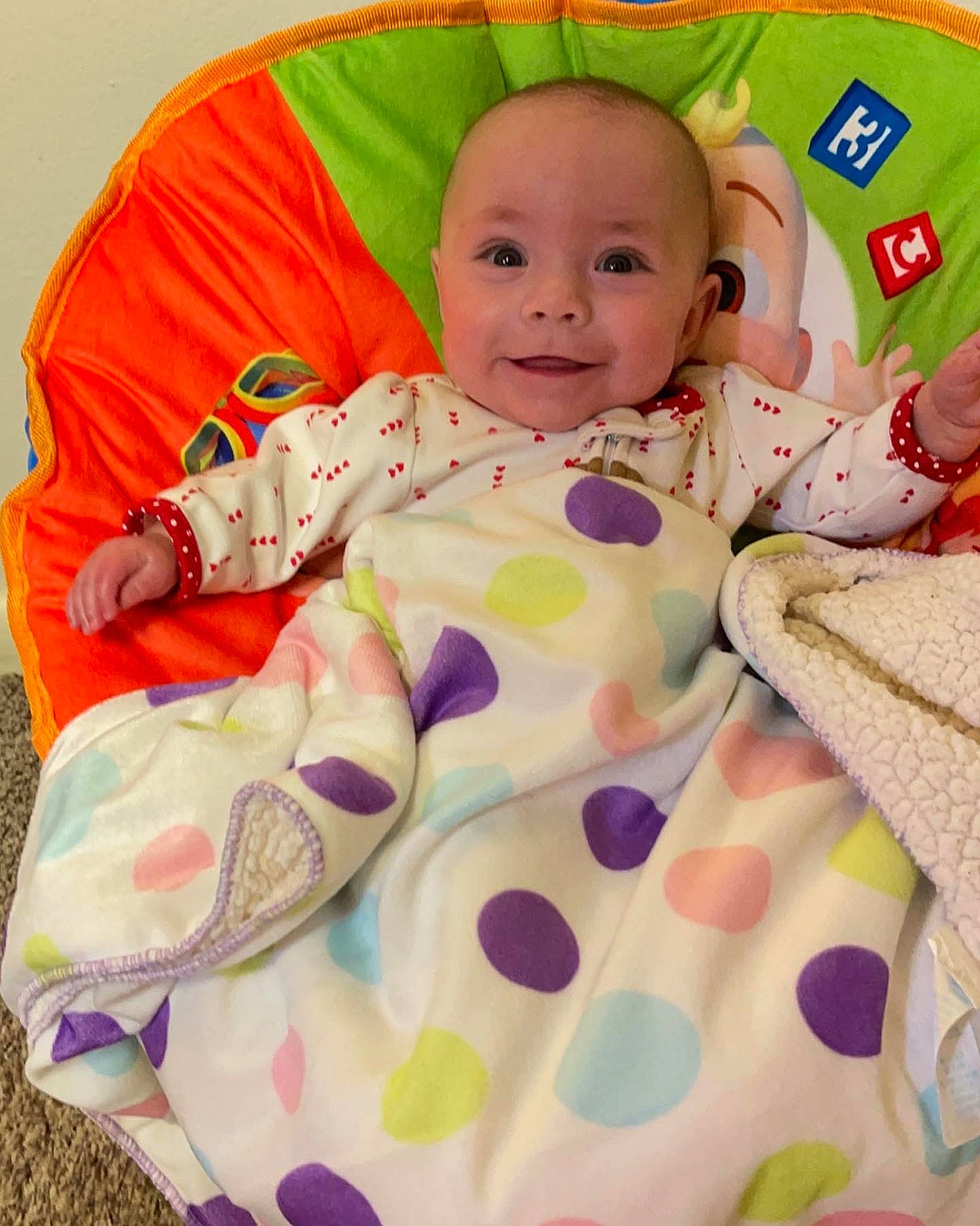 Karma joined the competition — help win amazing prizes! baby, baby_products, baby_safety, baby_sleeping, baby_toddler_clothing, baby_toys, bedding, child, comfort, face, happy, joy, linens, pattern, person, pink, play, sitting, sleeve, smile