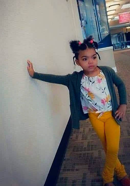 Tafari is registered to the contest to win money with this photo: abdomen, black_hair, denim, electric_blue, fashion_design, flooring, happy, human_leg, knee, long_hair, person, selfie, shoulder, sleeve, sportswear, standing, street_fashion, t_shirt, thigh, trunk