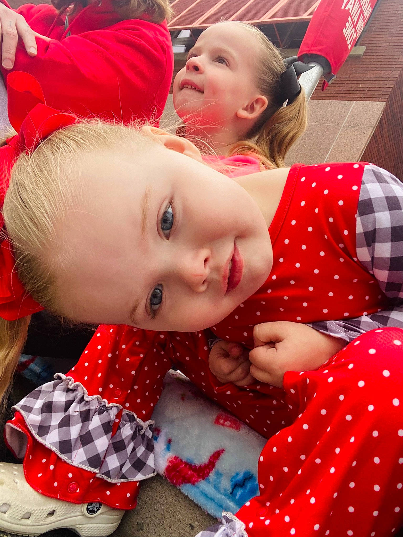 Ellianna joined the competition — help win amazing prizes! baby_toddler_clothing, carmine, child, event, facial_expression, fun, grass, happy, leisure, pattern, person, plaid, polka_dot, portrait_photography, red, sleeve, smile, tartan, toddler, tradition