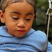 Azaraiah is registered to the contest to win money with this photo: accessories, child, clothing, coat, face, female, girl, hair, head, jacket, jewelry, necklace, outdoorplayarea, outdoors, person, photography, playarea, portrait, swing, toy