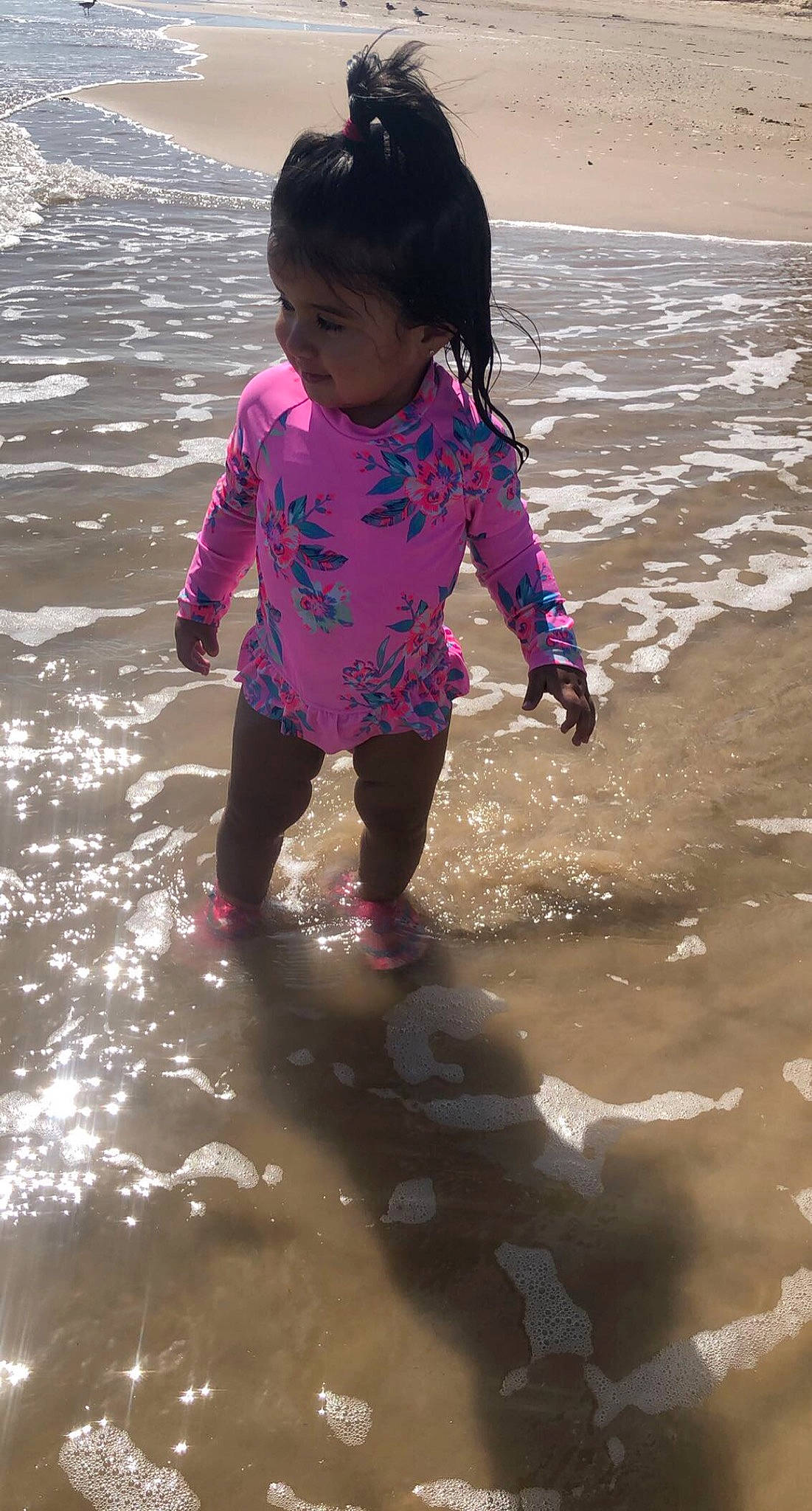 Jazmine joined the competition — help win amazing prizes! baby, baby_toddler_clothing, barefoot, beach, child, magenta, people_on_beach, person, pink, play, puddle, purple, toddler, wind_wave