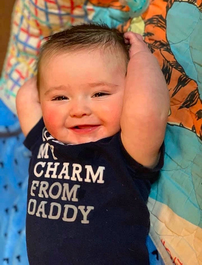 Huntley is registered to the contest to win money with this photo: arm, baby, baby_products, baby_toddler_clothing, cheek, child, face, forehead, head, joy, nose, person, product, smile, toddler