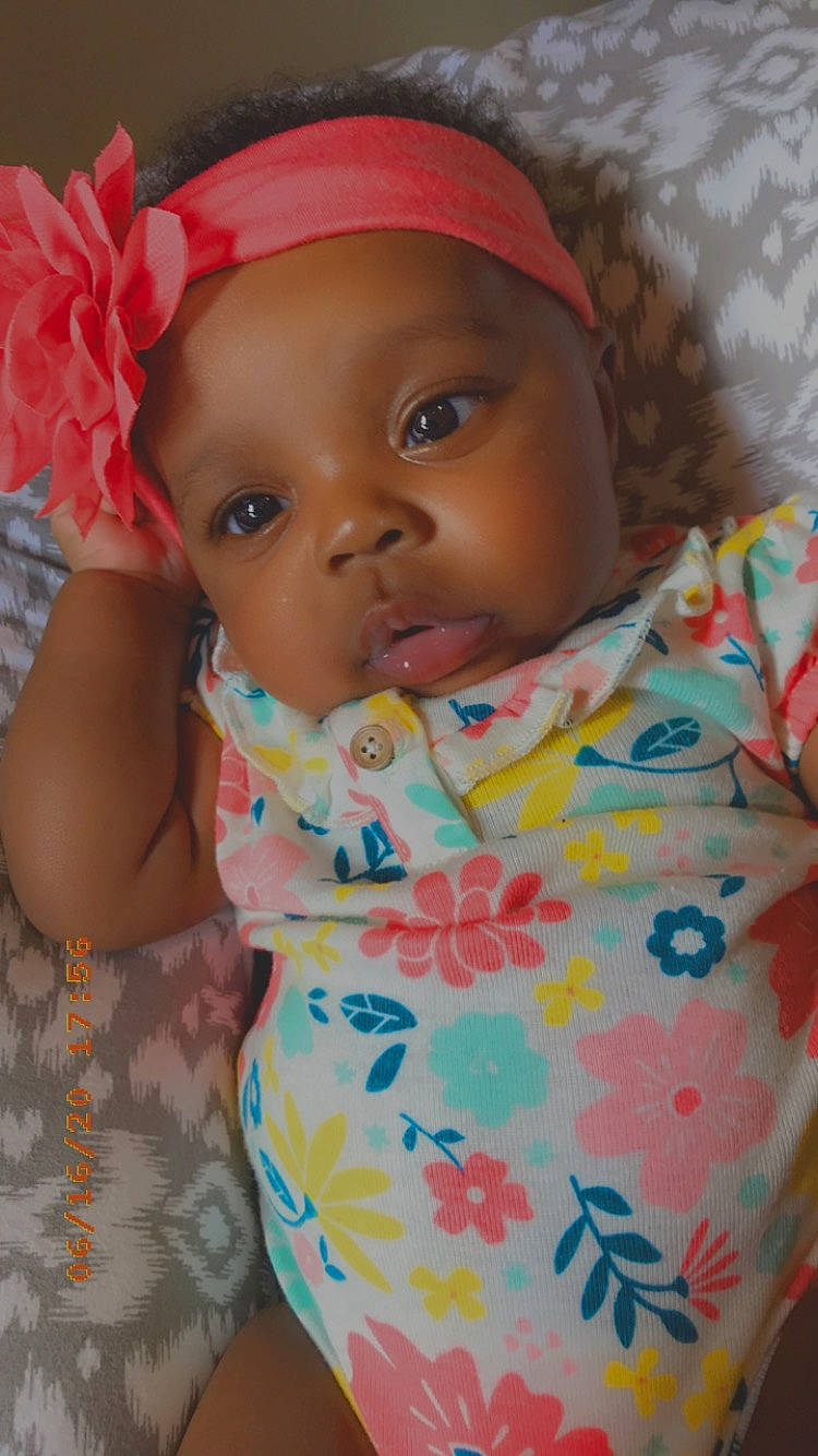 Haleigh is registered to the contest to win money with this photo: baby, baby_products, baby_toddler_clothing, cheek, child, hair_accessory, headgear, headwear, person, pink, product, skin, textile, toddler