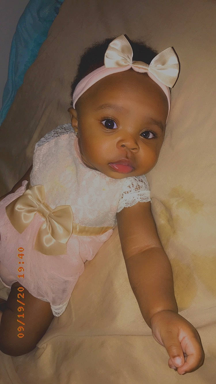 Haleigh is registered to the contest to win money with this photo: baby, baby_products, baby_toddler_clothing, cheek, child, hair_accessory, head, iris, person, product, skin, toddler