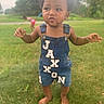 Jaxxon joined the competition — help win amazing prizes! toddler, child, denim_overalls, grass, outdoor, barefoot, droplet, curly_hair, greenery, blurred_background, person, summer, nature, playground, casual_clothing, cute, standing, daylight, two_children, park