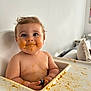 Charli participe au concours pour gagner de l'argent avec cette photo : baby, high_chair, messy, food, orange_food, face, hands, blue_eyes, chubby_cheeks, indoor, couch, pillow, child, cute, infant, feeding, smile, human, skin, expression