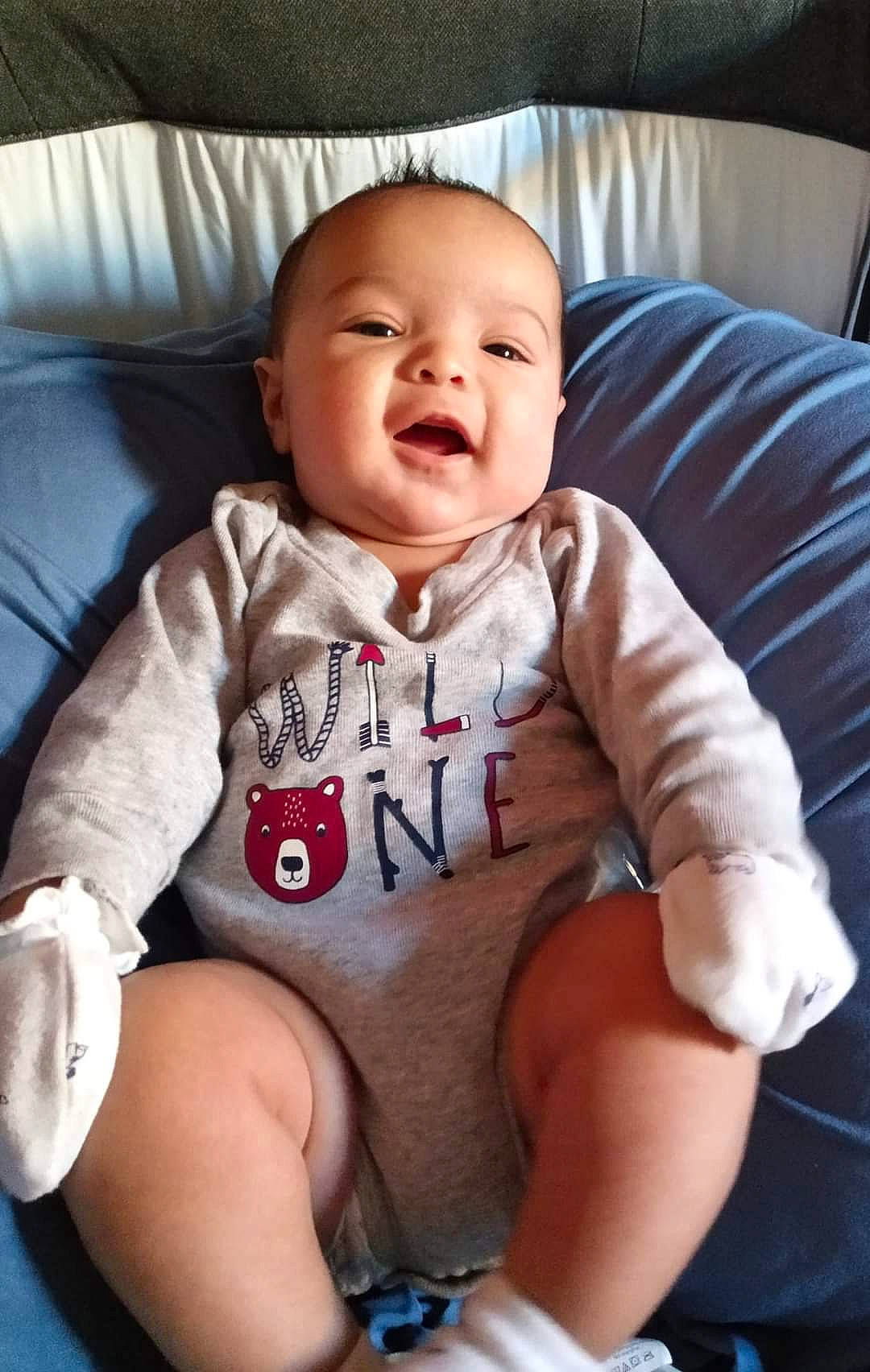 Isaac joined the competition — help win amazing prizes! arm, baby, baby_toddler_clothing, cheek, child, comfort, elbow, eye, face, hand, human_body, knee, mouth, neck, person, skin, sleeve, smile, stomach, t_shirt