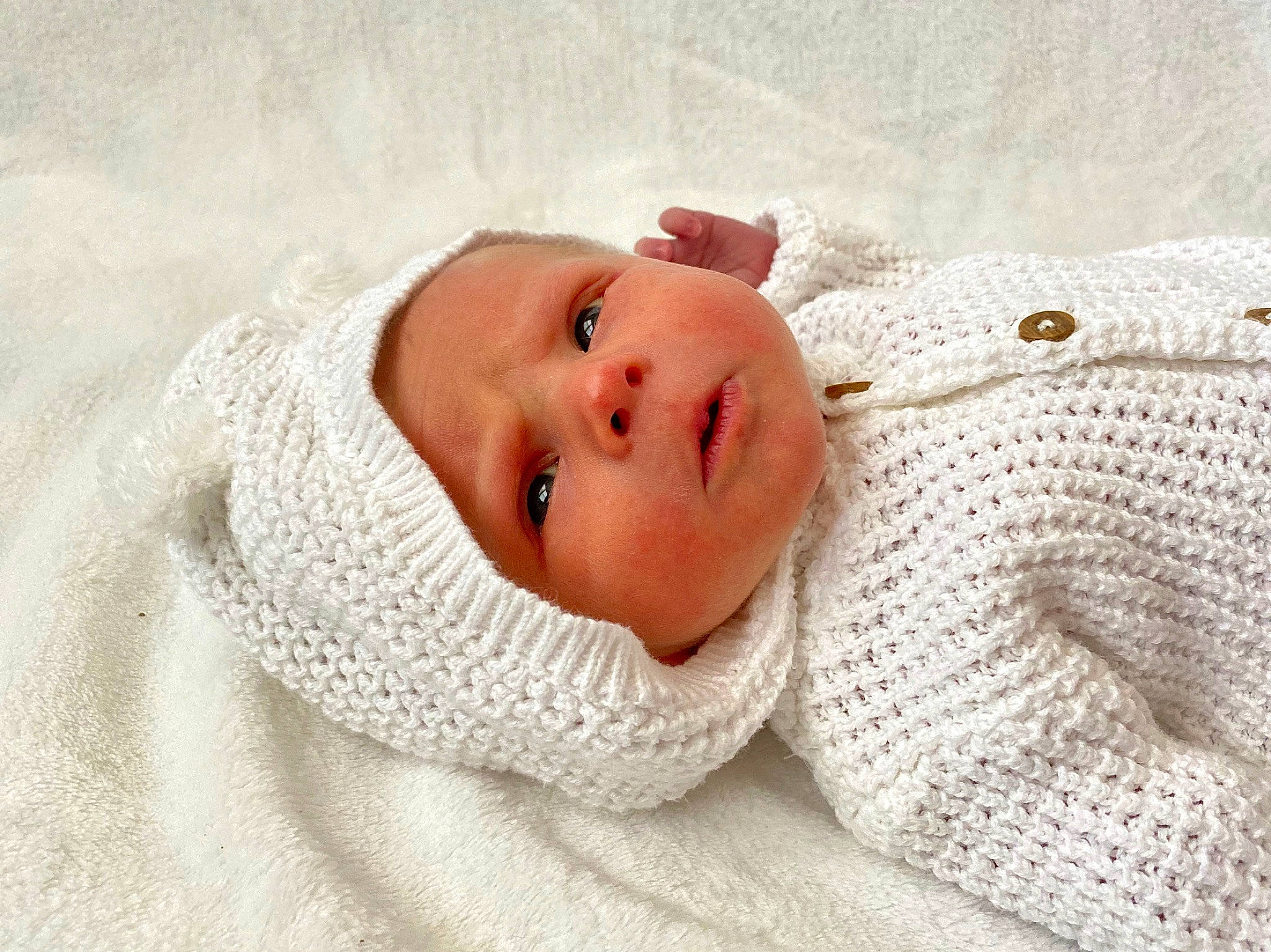 Eastyn is registered to the contest to win money with this photo: art, baby, baby_products, baby_sleeping, baby_toddler_clothing, cheek, child, comfort, eye, fashion_accessory, fur, knit_cap, linens, pattern, person, room, sleeve, toddler, towel, wool