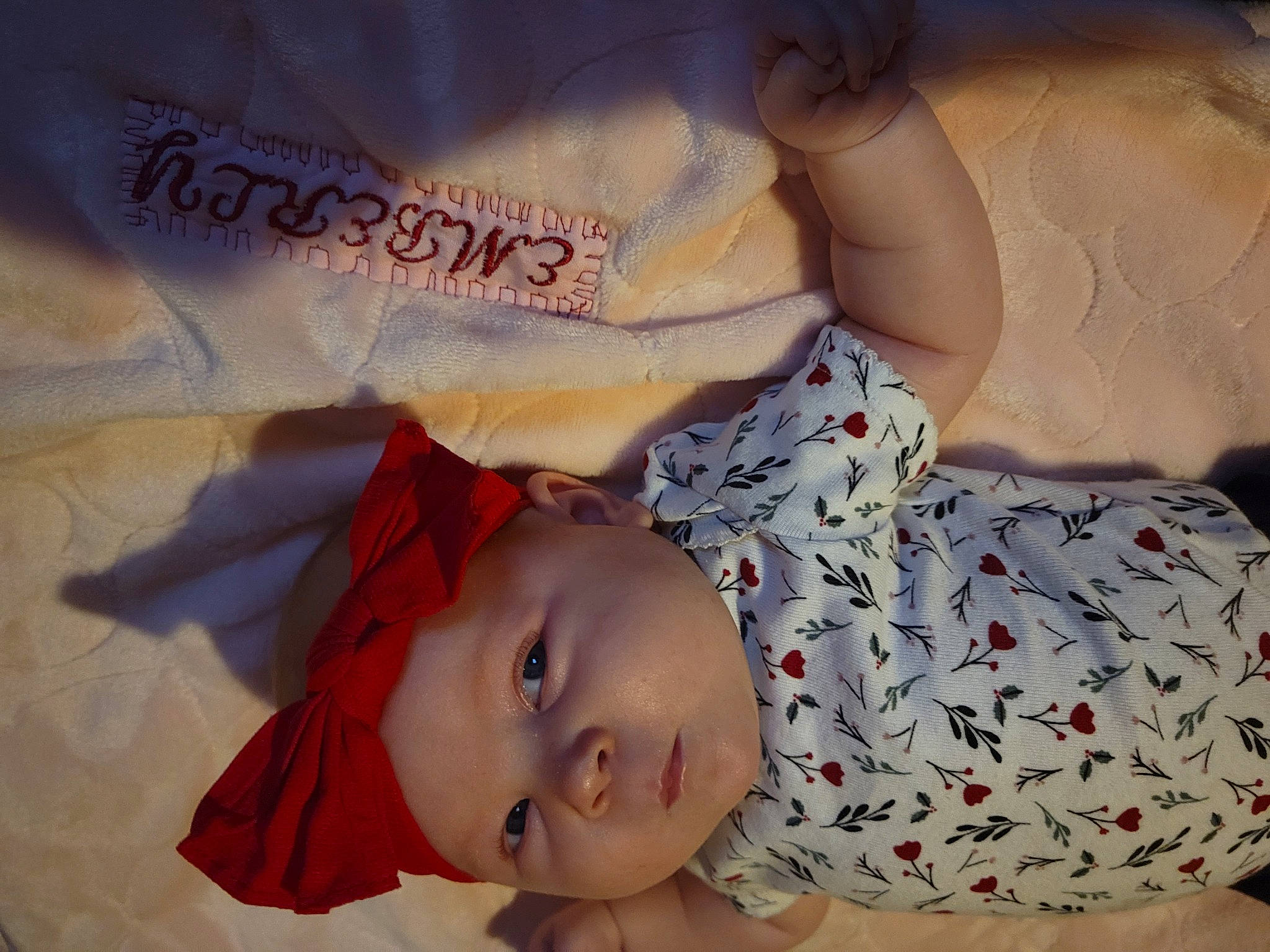 Emberly is registered to the contest to win money with this photo: baby, baby_products, baby_sleeping, baby_toddler_clothing, cheek, child, comfort, eyelash, happy, headwear, human_body, lip, mouth, nose, pattern, person, pink, skin, sleeve, smile