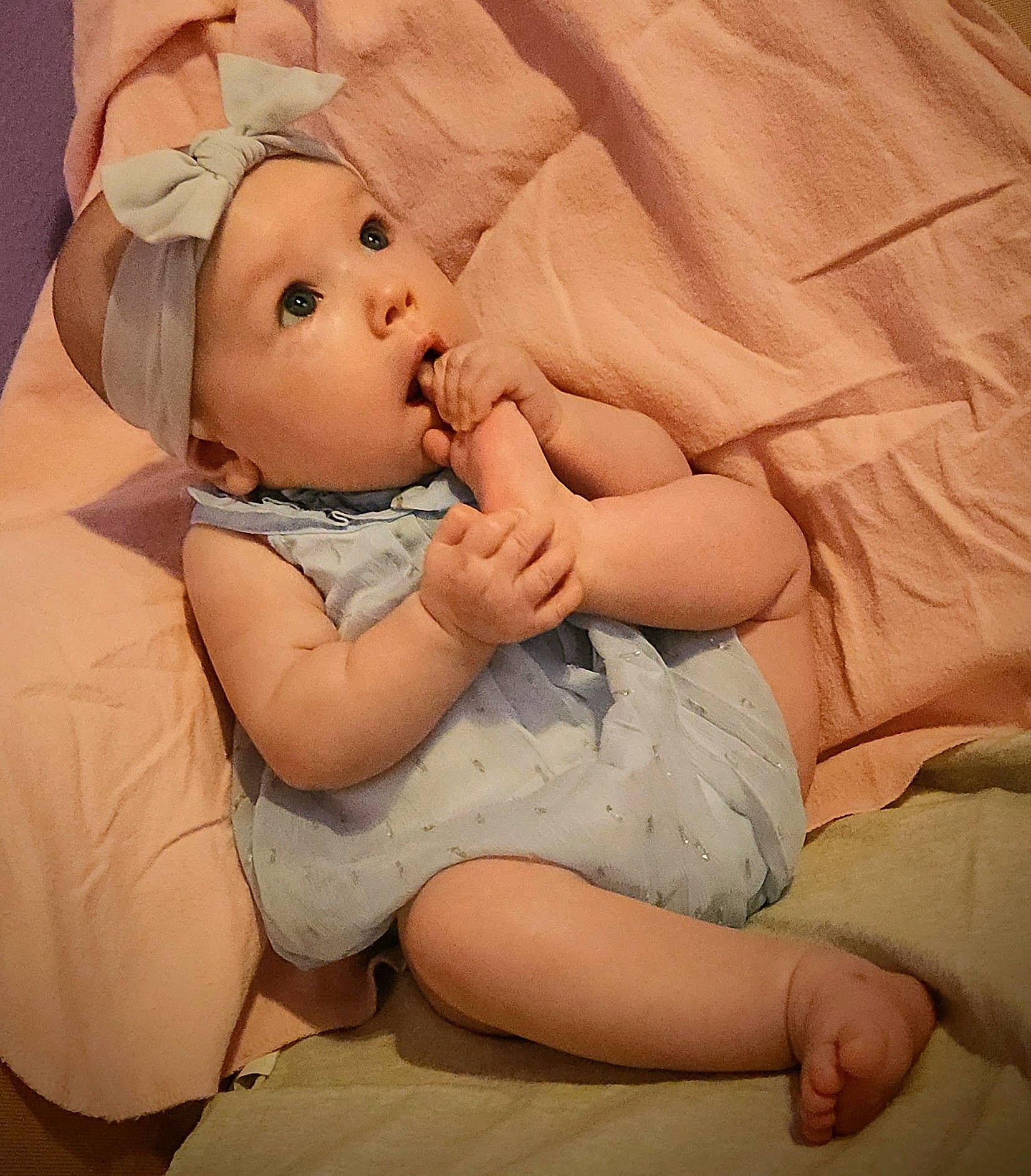 Novalee joined the competition — help win amazing prizes! abdomen, baby, baby_sleeping, baby_toddler_clothing, cheek, chest, child, comfort, gesture, happy, headwear, human_body, human_leg, linens, lip, person, sitting, skin, stomach, surprise