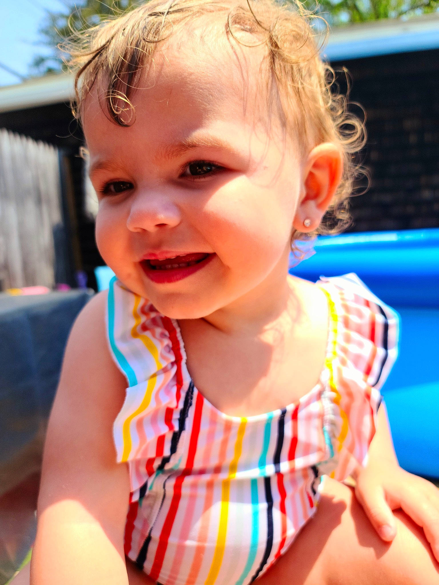 Laylah is registered to the contest to win money with this photo: azure, baby_toddler_clothing, blue, chin, eyelash, face, facial_expression, grass, hairstyle, happy, head, iris, joy, leisure, lip, mouth, neck, nose, person, skin