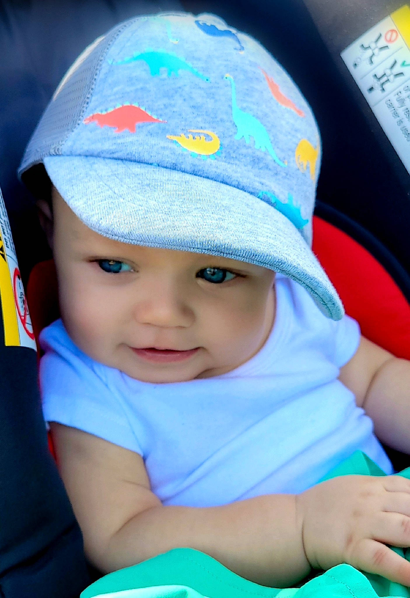 Larson is registered to the contest to win money with this photo: azure, baby, baby_toddler_clothing, baseball_cap, blue, cap, child, electric_blue, facial_expression, fun, green, happy, hat, headgear, headwear, person, product, skin, smile, sun_hat