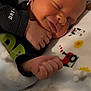 Mason joined the competition — help win amazing prizes! newborn, baby, sleeping, blanket, fleece, hand, face, clothing, infant, cute, peaceful, indoors, portrait, closeup, soft, colorful, patterned_blanket, child, resting, young